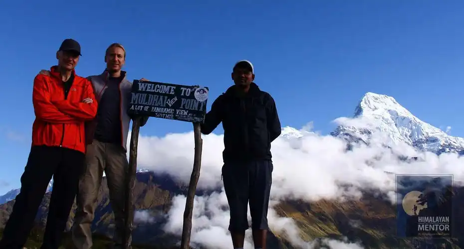 Clients are posing a photograph with a guide at Muldhai view point
