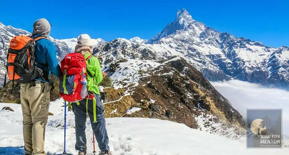 A couple is enjoying the magnificent Machhapuchhre view during the trek
