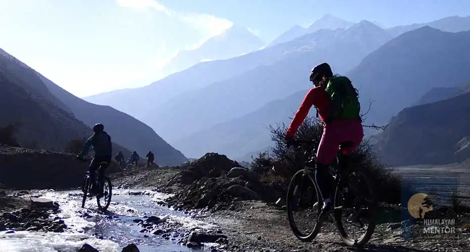 Crossing the Khola (tiny river) riding bikes