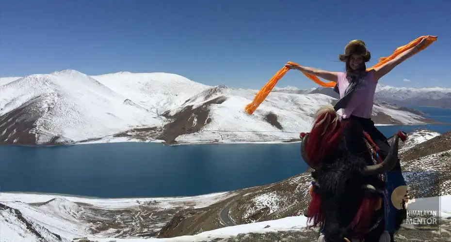 Our client is posing for a photograph while travelling from Lhasa to Gyantse