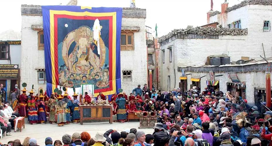 Local and foreign travelers gathering in front of Thangka for the Tiji celebration