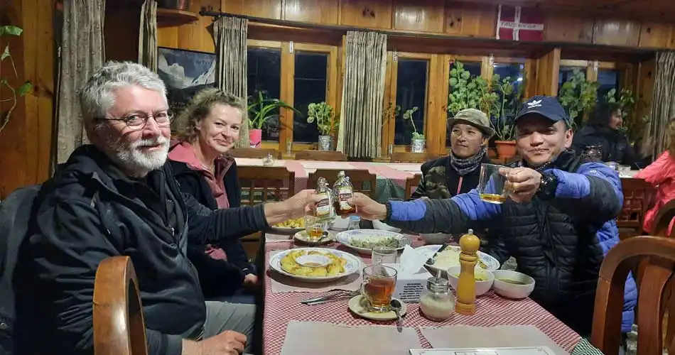 Couple are enjoying the last night in mountain after Gokyo Lake trek